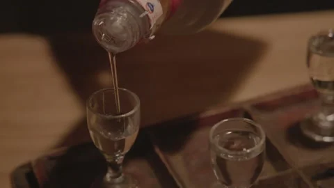 Chinese Baijiu Tasting Flight Being Poured Into Glasses in Beijing Bar Stock Footage 345749902