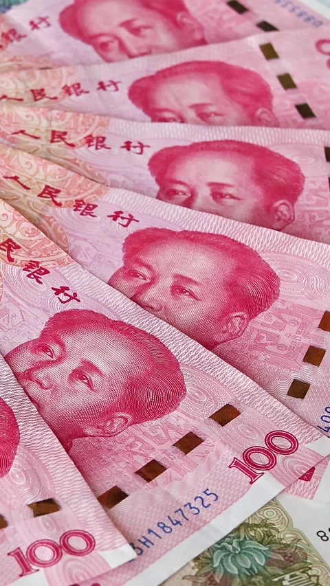 Chinese banknotes of diffrent value or renminbi on rotating surface Stock Footage 336711785