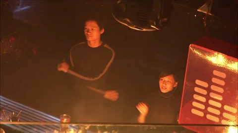 Chinese bartenders dancing behind bar Stock Footage 57375230