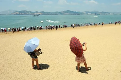 Chinese at the beach Stock Photos