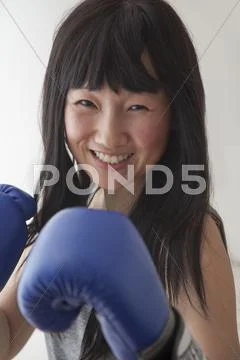 Chinese boxer with raised fists Stock Photos