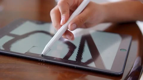 Chinese boy drawing on digital tablet Stock Footage 195838677