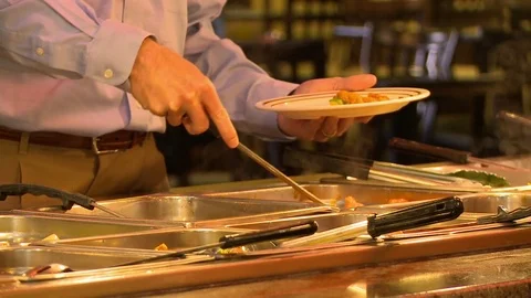 Chinese Buffet man with plate Stock Footage 72087355