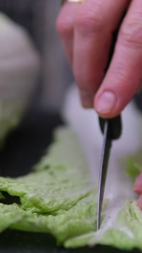 Chinese cabbage slices on a baking sheet covered with baking paper. Stock Footage 306014826