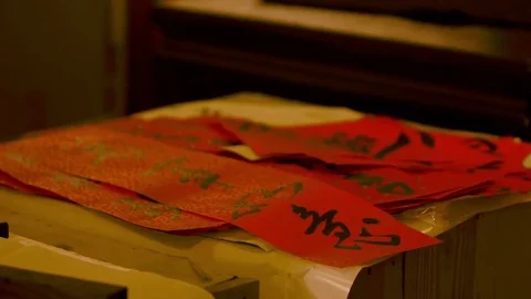 Chinese calligraphy on red papers in the Lunar New Year Fair in Dihua Street. Stock Footage 77267014