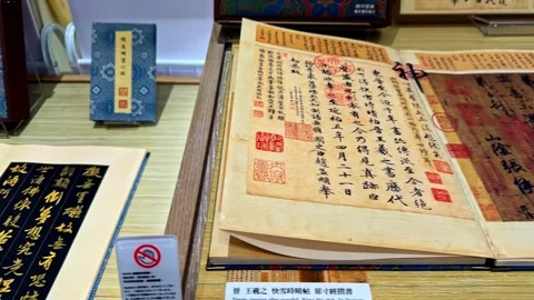 Chinese characters and writing painted on papyrus paper are displayed in a shop. Stock Footage 334064530