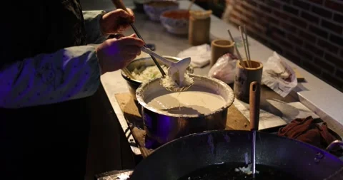 Chinese Chef Making Fried Pastry 4K Slow Motion Oil Frying Macro Close Up Stock Footage 263101865