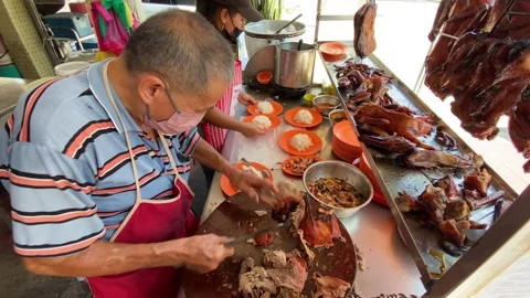 A Chinese chef prepares Roasted Duck in Georgetown, Penang, Malaysia 4K Stock Footage 260697298