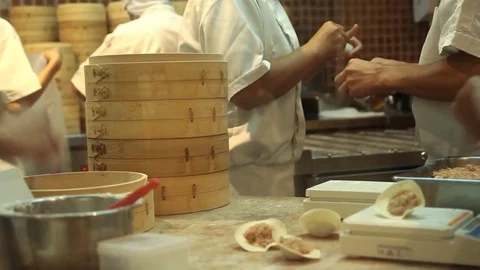 Chinese chef preparing food in kitchen Video stock 77638583
