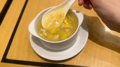 Chinese Chicken Corn Soup Being Spooned in Restaurant Close Up 스톡 동영상 335914250