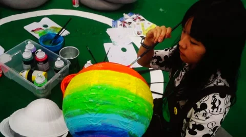 Chinese children are painting the earth model with the brush Stock Footage