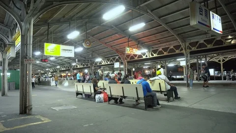 Chinese Commuters Waiting at Train Station at Night Stock Footage 107286971