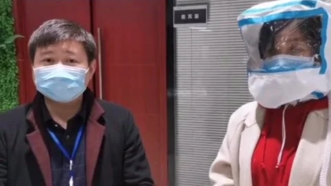Chinese company develops protective hood for medical staff fighting coronavirus Video stock 273011899