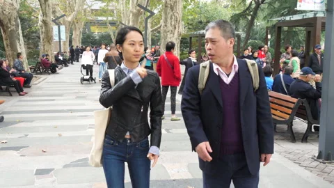 Chinese deaf people using sign langauge in park – SloMo Stock Footage 195264670