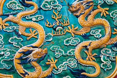 Chinese decoration pattern. Two yellow dragons, green background Stock Photos