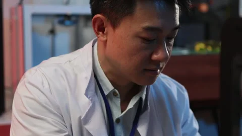 Chinese developer in laboratory coat researching new medical component printing Stock Footage 153744367