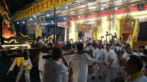 Chinese devotees carry god statute at sedan chair dance Stock Footage 229768375
