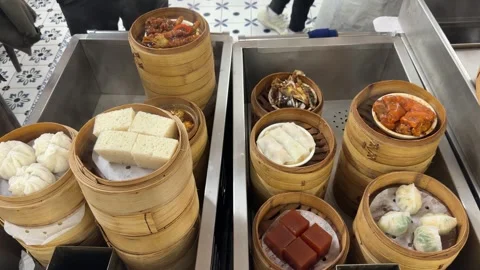 Chinese Dim Sum in a bamboo steamer with smoke Stock Footage 329426564