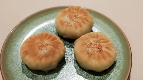 Chinese dim sum pan fried mini pancake bun filled with minced mutton meat Stock Footage 313221246