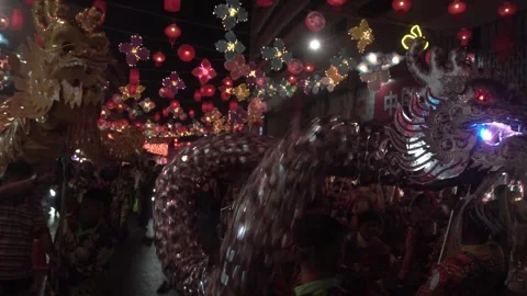 Chinese dragon performing in Chinatown . Stock Footage 250436880