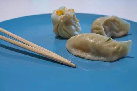 Chinese dumpling in foreground Fotos de archivo