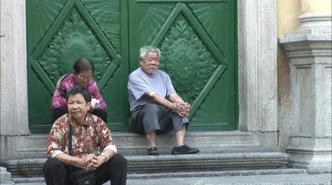 Chinese elders sitting outside, Macau, China Stock Footage 56618248