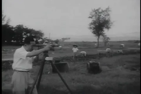 Chinese engineer and workers in action to house men and equipments - 1958 Stock-Footage 99591681