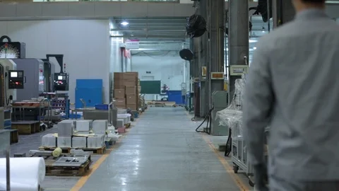 Chinese engineers walking and talking in factory,HD Stock Footage 117907973