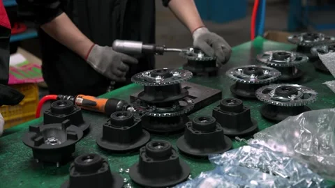 Chinese Factory Worker Installs Component during Engine Assembly Line Stock Footage 336772127