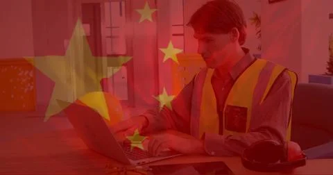 Chinese flag image over construction worker using tablet and laptop in office Stock Photos