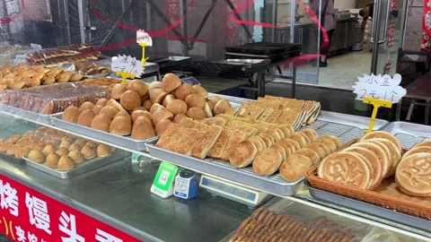 Chinese Flatbreads and Baked Snacks Displayed at Dandong Market Stock Footage 340175974