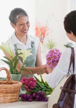 Chinese florist giving flowers to customer Stock Photos