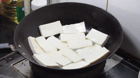 Chinese food: Cooking tofu Stock Footage