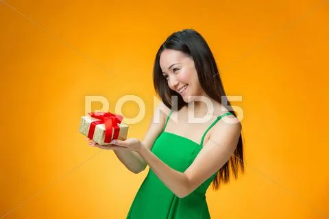 Chinese girl with a gift Stock Photos