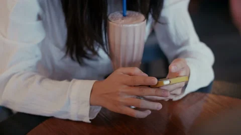 Chinese girl talking on the phone in cafe Stock Footage 59082064
