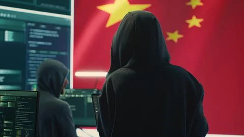 Chinese hacker working in governmental hacking room with Chinese flag Stock Photos