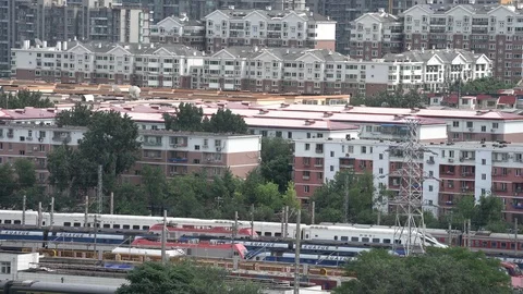 A Chinese high speed train running past residential area in downtown Beijing Stock Footage 93698880