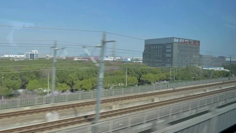 Chinese high speed train. View outside window of High Speed Train driving at 350 Stock Footage 129999922