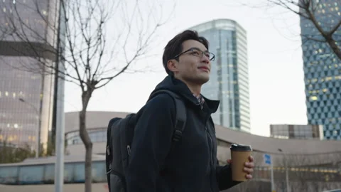 Chinese IT worker holding a cup of coffee,4K Stock Footage 243470280