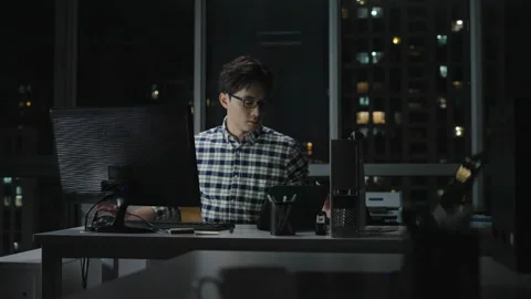 Chinese IT worker working in office at night,4K Stock Footage 243447686