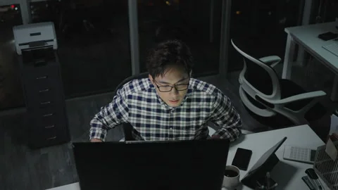 Chinese IT worker working in office at night,4K Stock Footage 243452820