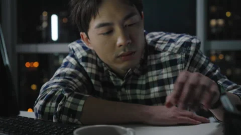 Chinese IT worker working in office at night,4K Stock Footage 243458129