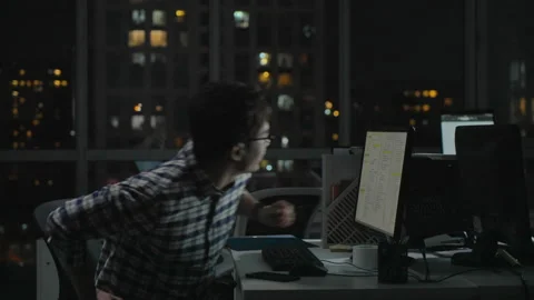 Chinese IT worker working in office at night,4K Stock Footage 243460086