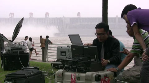 Chinese journalists editing on Three Gorges Dam Stock Footage