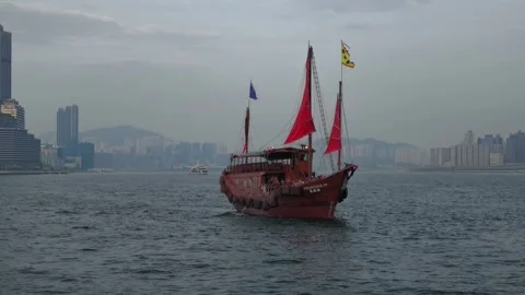 Chinese Junk Boat Red Sails, Hong Kong Skyline, Hong Kong Stock Footage 345224904