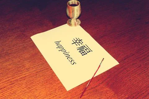 Chinese Language Day. On the table is a white sheet of paper on which the wor Stock Photos