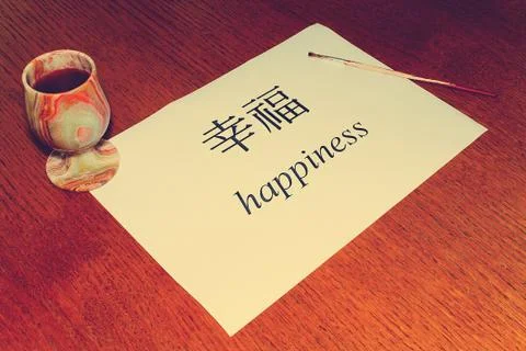 Chinese Language Day. On the table is a white sheet of paper on which the wor Stock Photos
