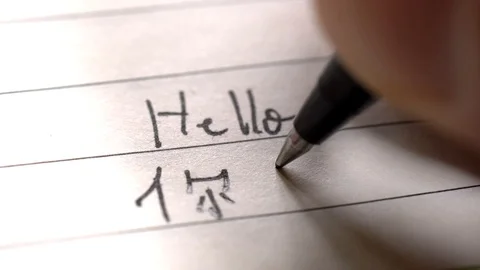 Chinese language learner writing Hello word Nihao Stock Footage 107350639