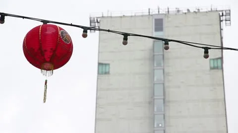 Chinese lantern in front of a skyscraper Stock Footage 21769223