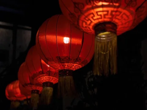 Chinese lantern &amp; light bulb on dark background. Stock Footage 129748227